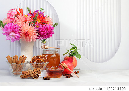 Autumn greeting and Thanksgiving concept, Autumn banner with a beautiful bouquet of dahlias in a vase, honey, apples, pomegranates, cinnamon and star anise on a sunny background, Autumn greeting and Thanksgiving concept, Autumn banner with a beautiful bouquet of dahlias in a vase, honey, apples, pomegranates, cinnamon and star anise on a sunny background, 131213393