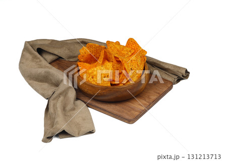 Nachos in a wooden bowl. Tortilla chips on wooden background. Nachos in a wooden bowl. Tortilla chips on wooden background. 131213713