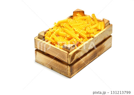 pile of spiral pasta scattered on light background 131213799