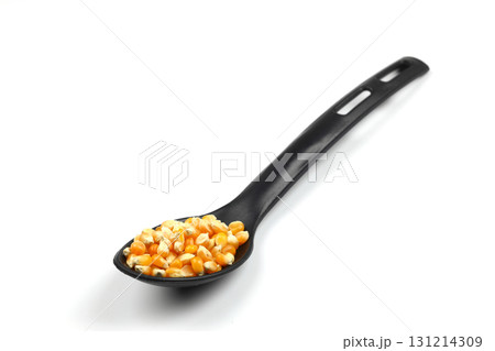 sweet corn in the black spoon an isolated on white background 131214309