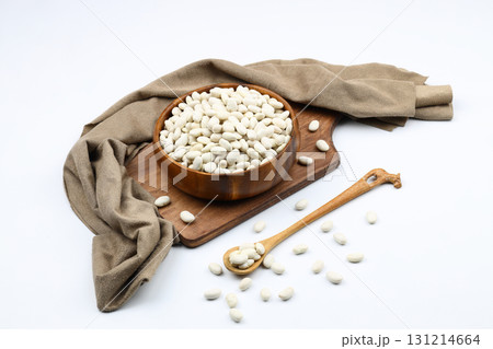 white kidney bean in wooden bowl isolated on white background. Top view. Flat lay white kidney bean in wooden bowl isolated on white background. Top view. Flat lay 131214664