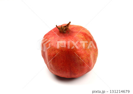 Ripe pomegranate fruit peeled on a white background top view close-up. Large open pomegranate fruit with large ripe grains isolated. Sliced exotic fruit. Ripe pomegranate fruit peeled on a white background top view close-up. Large open pomegranate fruit with large ripe grains isolated. Sliced exotic fruit. 131214679
