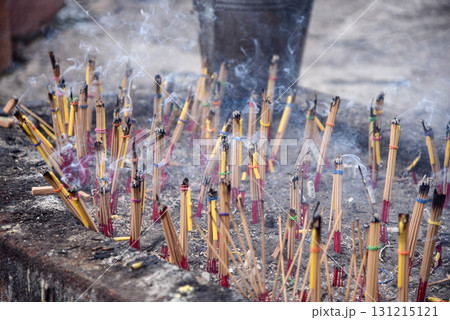 A stone pot with incense sticks and candles tied together. and is on fire There was a lot of smoke rising up. To worship holy things or ask for blessings from supernatural beings A stone pot with incense sticks and candles tied together. and is on fire There was a lot of smoke rising up. To worship holy things or ask for blessings from supernatural beings 131215121