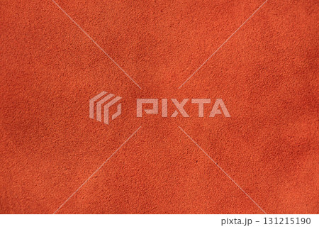 Red suede with a warm tint macro photo as a background. 131215190