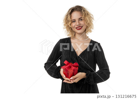Woman smiles with a red gift box at celebrations, isolated, PNG Woman smiles with a red gift box at celebrations, isolated, PNG 131216675