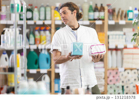 Man view trademark sign on label, chooses eco friendly panty liners 131218378