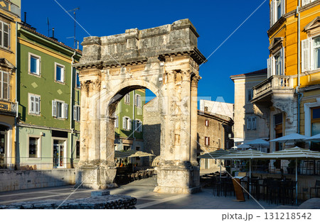 Ancient Arch of Sergii blending with Pula old town street life Ancient Arch of Sergii blending with Pula old town street life 131218542