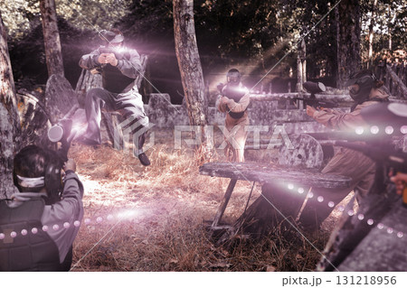 Tactical paintball players training on battlefield 131218956