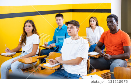 Men and women studying in taxi driving school 131218976