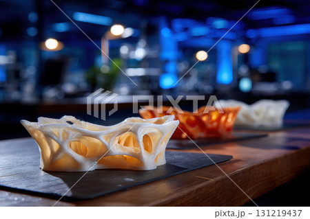 Intricate 3D printed designs showcased on a sleek table 131219437