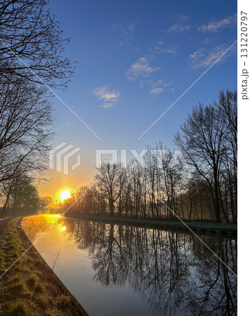 Experience the serene beauty of a sunrise reflecting on the tranquil rivers canvas Experience the serene beauty of a sunrise reflecting on the tranquil rivers canvas 131220797