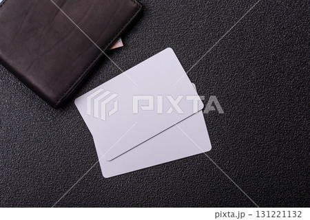 The white plastic card as a symbol of cashless payments on the background of cash paper money of Brazil The white plastic card as a symbol of cashless payments on the background of cash paper money of Brazil 131221132