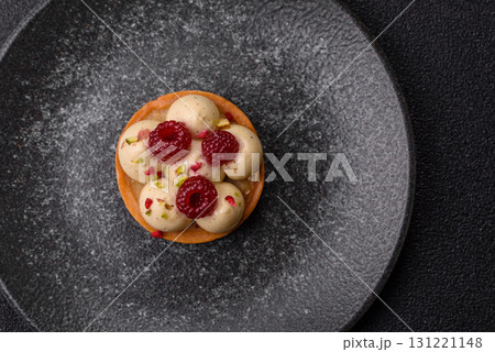 Sweet cake or tart round with cream and raspberries. Raspberry sweet tart 131221148