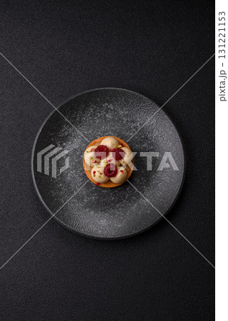 Sweet cake or tart round with cream and raspberries. Raspberry sweet tart Sweet cake or tart round with cream and raspberries. Raspberry sweet tart 131221153