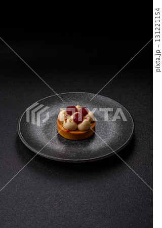 Sweet cake or tart round with cream and raspberries. Raspberry sweet tart Sweet cake or tart round with cream and raspberries. Raspberry sweet tart 131221154