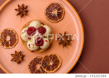 Sweet cake or tart round with cream and raspberries. Raspberry sweet tart 131221164