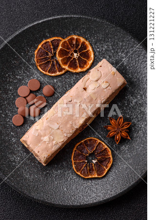 Nougat or white caramel with hazelnuts and pistachios and citrus pieces. White nougat with nuts Nougat or white caramel with hazelnuts and pistachios and citrus pieces. White nougat with nuts 131221227