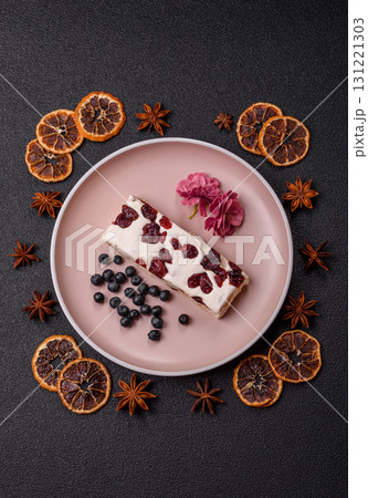 Nougat or white caramel with hazelnuts and pistachios and citrus pieces. White nougat with nuts 131221303