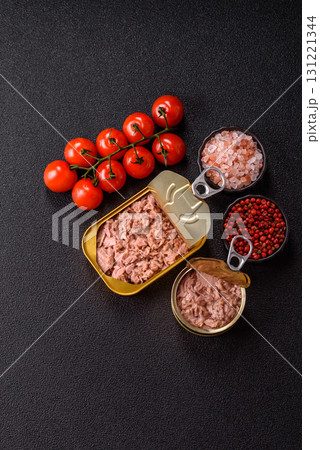 Tuna, canned fish in a can and on a plate for making sandwiches and other food. Canned tuna Tuna, canned fish in a can and on a plate for making sandwiches and other food. Canned tuna 131221344