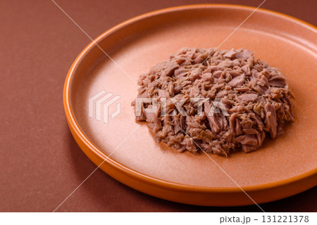 Tuna, canned fish in a can and on a plate for making sandwiches and other food. Canned tuna Tuna, canned fish in a can and on a plate for making sandwiches and other food. Canned tuna 131221378