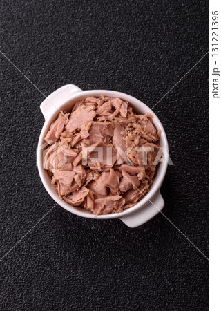 Tuna, canned fish in a can and on a plate for making sandwiches and other food. Canned tuna Tuna, canned fish in a can and on a plate for making sandwiches and other food. Canned tuna 131221396