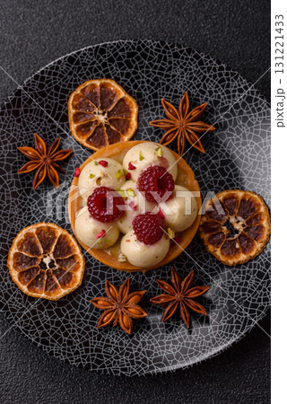Sweet cake or tart round with cream and raspberries. Raspberry sweet tart Sweet cake or tart round with cream and raspberries. Raspberry sweet tart 131221433
