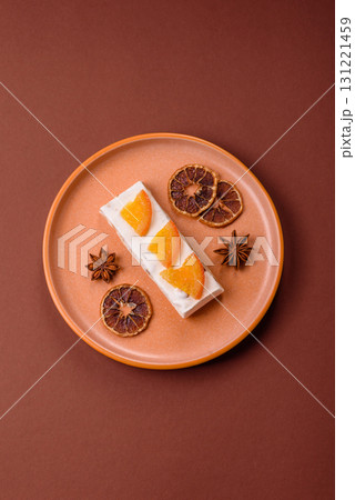 Nougat or white caramel with hazelnuts and pistachios and citrus pieces. White nougat with nuts Nougat or white caramel with hazelnuts and pistachios and citrus pieces. White nougat with nuts 131221459
