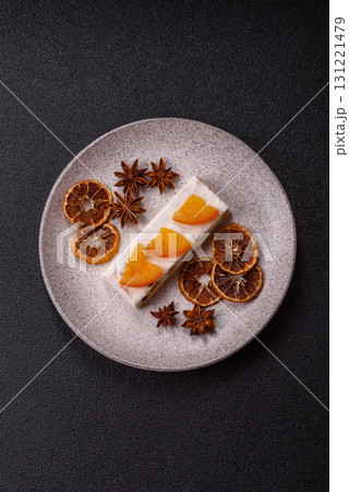 Nougat or white caramel with hazelnuts and pistachios and citrus pieces. White nougat with nuts 131221479