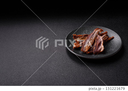 Dried salted fish as snacks or jerky, seafood as slices. Dried seafood snacks Dried salted fish as snacks or jerky, seafood as slices. Dried seafood snacks 131221679