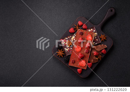 Bar sweet craft artisan chocolate with dried fruits made at home. Craft chocolate 131222020