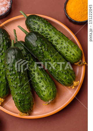 Fresh raw whole cucumbers, an ingredient for preparing salads and vegetarian dishes. Green fresh cucumbers 131222045