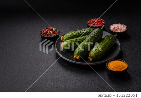 Fresh raw whole cucumbers, an ingredient for preparing salads and vegetarian dishes. Green fresh cucumbers 131222051