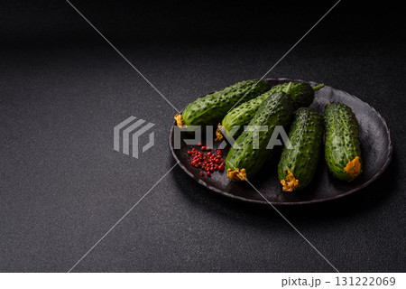 Fresh raw whole cucumbers, an ingredient for preparing salads and vegetarian dishes. Green fresh cucumbers Fresh raw whole cucumbers, an ingredient for preparing salads and vegetarian dishes. Green fresh cucumbers 131222069