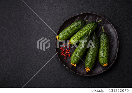 Fresh raw whole cucumbers, an ingredient for preparing salads and vegetarian dishes. Green fresh cucumbers Fresh raw whole cucumbers, an ingredient for preparing salads and vegetarian dishes. Green fresh cucumbers 131222070