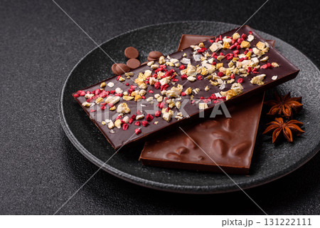 Bar sweet craft artisan chocolate with dried fruits made at home. Craft chocolate Bar sweet craft artisan chocolate with dried fruits made at home. Craft chocolate 131222111