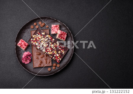 Bar sweet craft artisan chocolate with dried fruits made at home. Craft chocolate Bar sweet craft artisan chocolate with dried fruits made at home. Craft chocolate 131222152