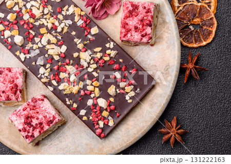 Bar sweet craft artisan chocolate with dried fruits made at home. Craft chocolate Bar sweet craft artisan chocolate with dried fruits made at home. Craft chocolate 131222163