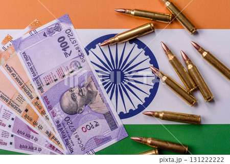 Money and flag of India with ammunition and tank as a concept of weapons for war. India and weapons Money and flag of India with ammunition and tank as a concept of weapons for war. India and weapons 131222222