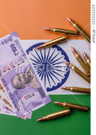 Money and flag of India with ammunition and tank as a concept of weapons for war. India and weapons Money and flag of India with ammunition and tank as a concept of weapons for war. India and weapons 131222223