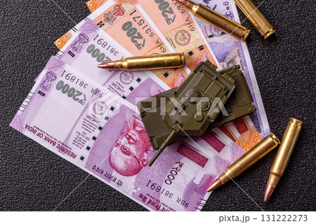 Money and flag of India with ammunition and tank as a concept of weapons for war. India and weapons 131222273