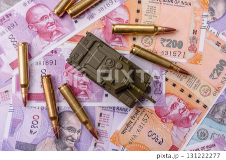 Money and flag of India with ammunition and tank as a concept of weapons for war. India and weapons 131222277