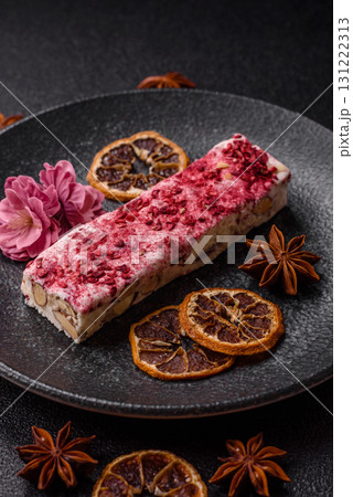 Nougat or white caramel with hazelnuts and strawberry pieces. White nougat 131222313