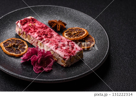 Nougat or white caramel with hazelnuts and strawberry pieces. White nougat Nougat or white caramel with hazelnuts and strawberry pieces. White nougat 131222314