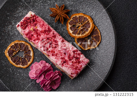 Nougat or white caramel with hazelnuts and strawberry pieces. White nougat Nougat or white caramel with hazelnuts and strawberry pieces. White nougat 131222315
