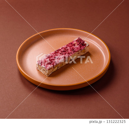 Nougat or white caramel with hazelnuts and strawberry pieces. White nougat Nougat or white caramel with hazelnuts and strawberry pieces. White nougat 131222325