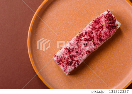 Nougat or white caramel with hazelnuts and strawberry pieces. White nougat Nougat or white caramel with hazelnuts and strawberry pieces. White nougat 131222327