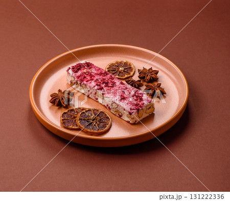 Nougat or white caramel with hazelnuts and strawberry pieces. White nougat 131222336