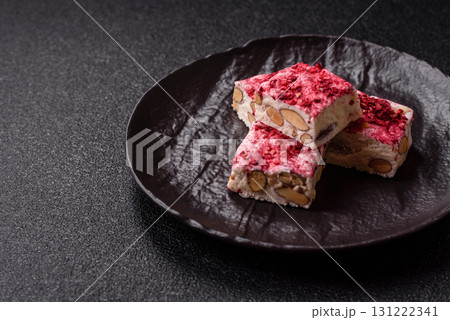 Nougat or white caramel with hazelnuts and strawberry pieces. White nougat 131222341