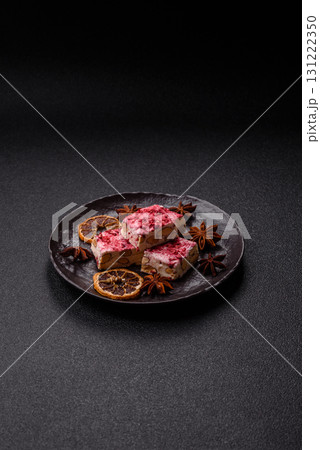 Nougat or white caramel with hazelnuts and strawberry pieces. White nougat Nougat or white caramel with hazelnuts and strawberry pieces. White nougat 131222350
