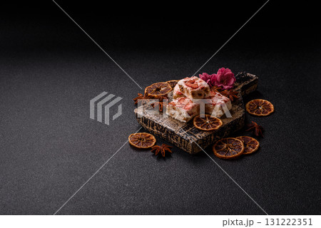 Nougat or white caramel with hazelnuts and strawberry pieces. White nougat 131222351